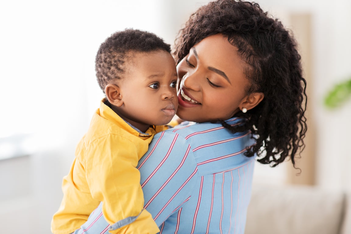 Happy African American Mother with Baby at Home