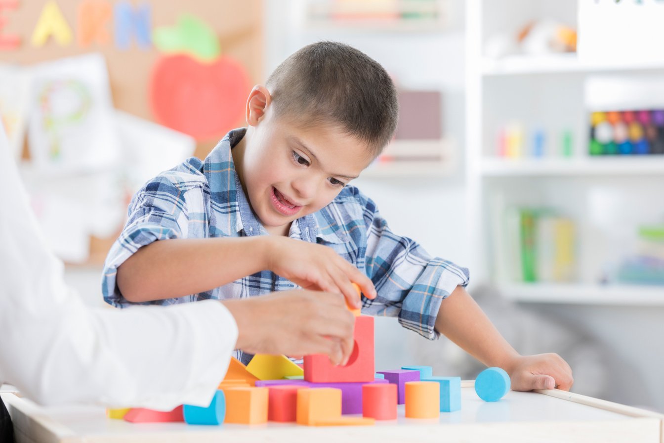 Boy with Down Syndrome Playing with Blocks 